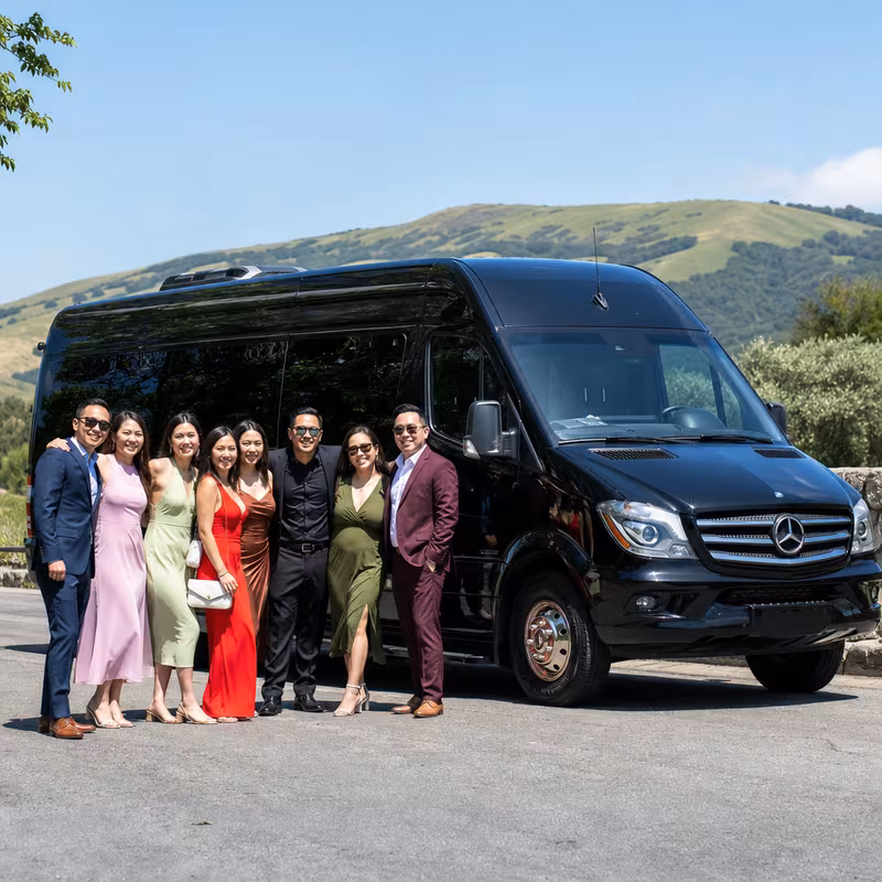 Group beside a Mercedes Sprinter limo from the San Jose fleet