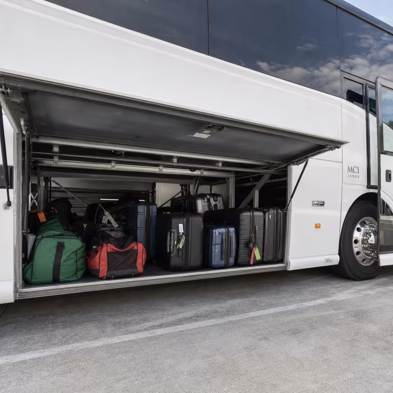 Party bus interior with wraparound leather seating and LED lighting in San Jose