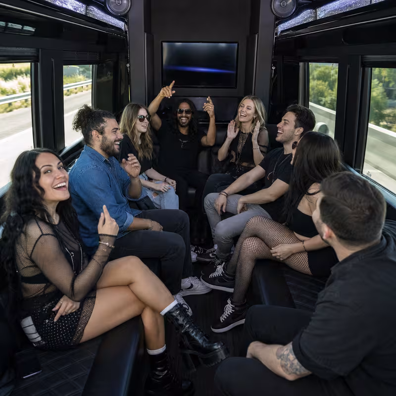 Group boarding a white charter bus for Concert Transportation transportation in San Jose