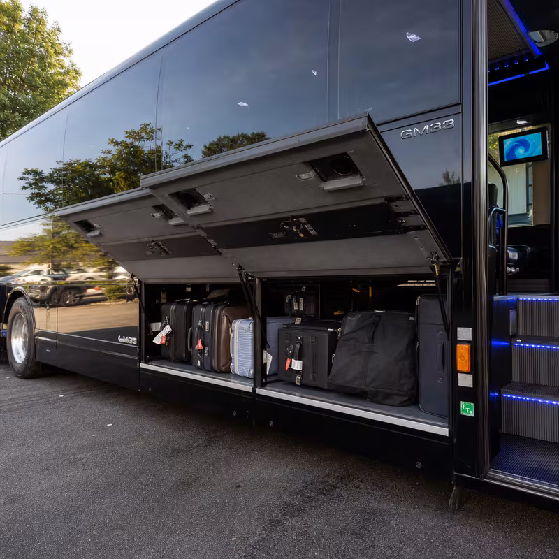 Party bus interior with wraparound leather seating and LED lighting in San Jose