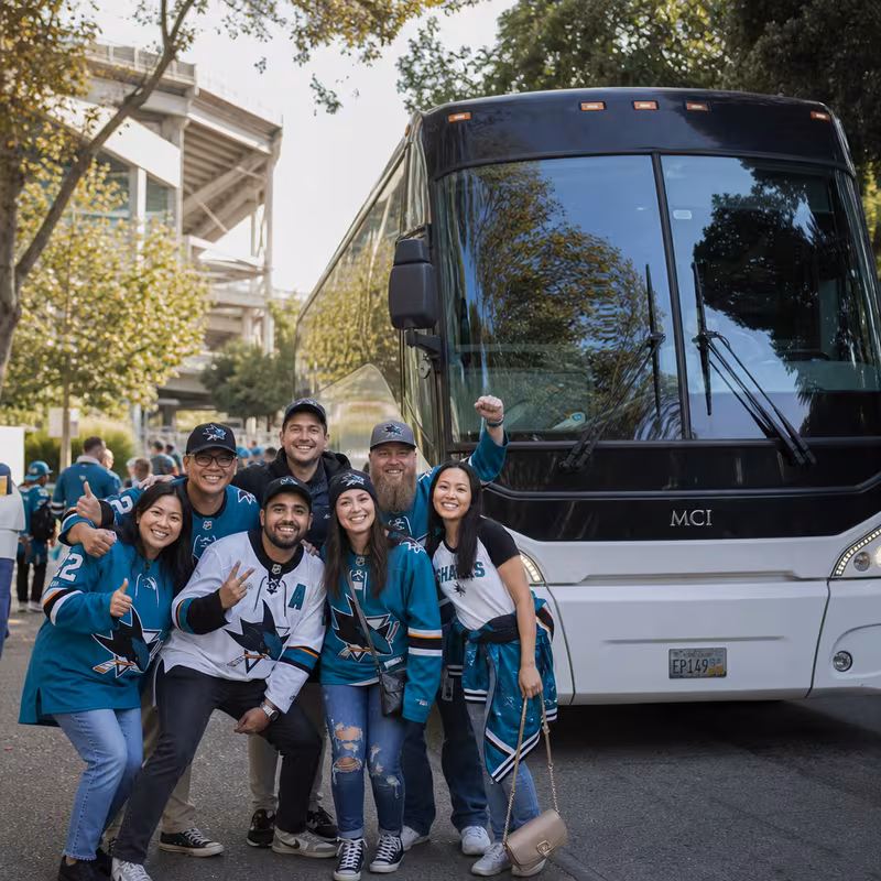 Passengers loading luggage while boarding an San Jose group shuttle