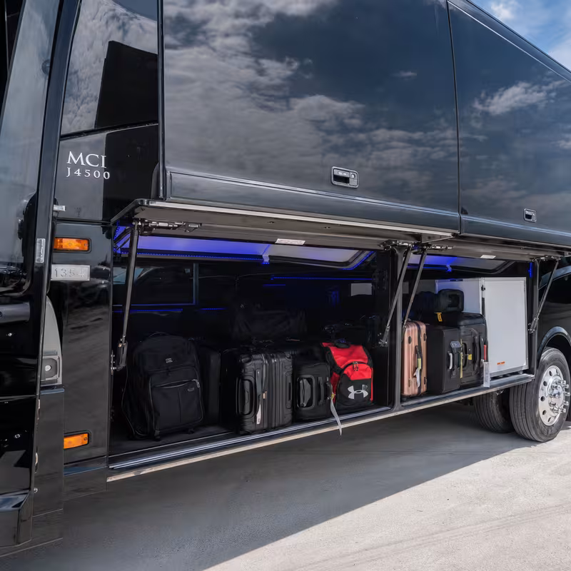 Party bus interior with wraparound leather seating and LED lighting in San Jose